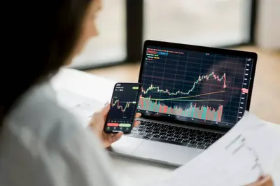 Illustration of a trader analyzing stock charts, representing technical analysis in trading.