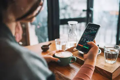 Illustration depicting a trader studying charts and market data, symbolizing the importance of trading education in equipping traders with knowledge and skills to make informed decisions in financial markets.