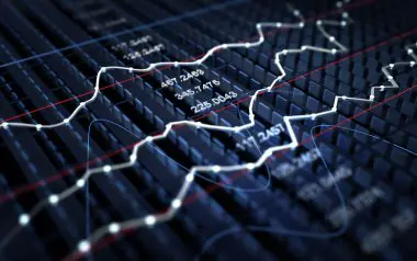 Image showing a trader reviewing financial statements and company performance metrics, representing the role of fundamental analysis in making informed investment decisions in stock market trades